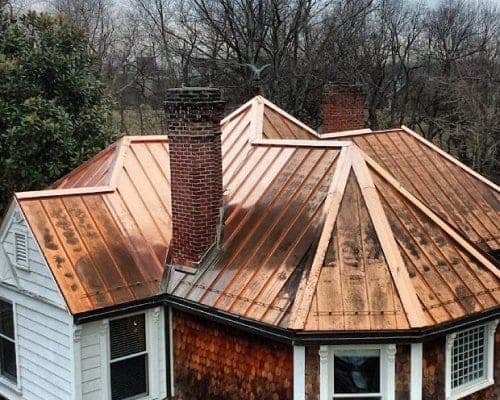 Hand-formed copper turret roof with a bright, unweathered finish